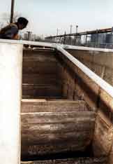 Billy Ivory looks into the mixing chamber, where the chemicals were added into the water