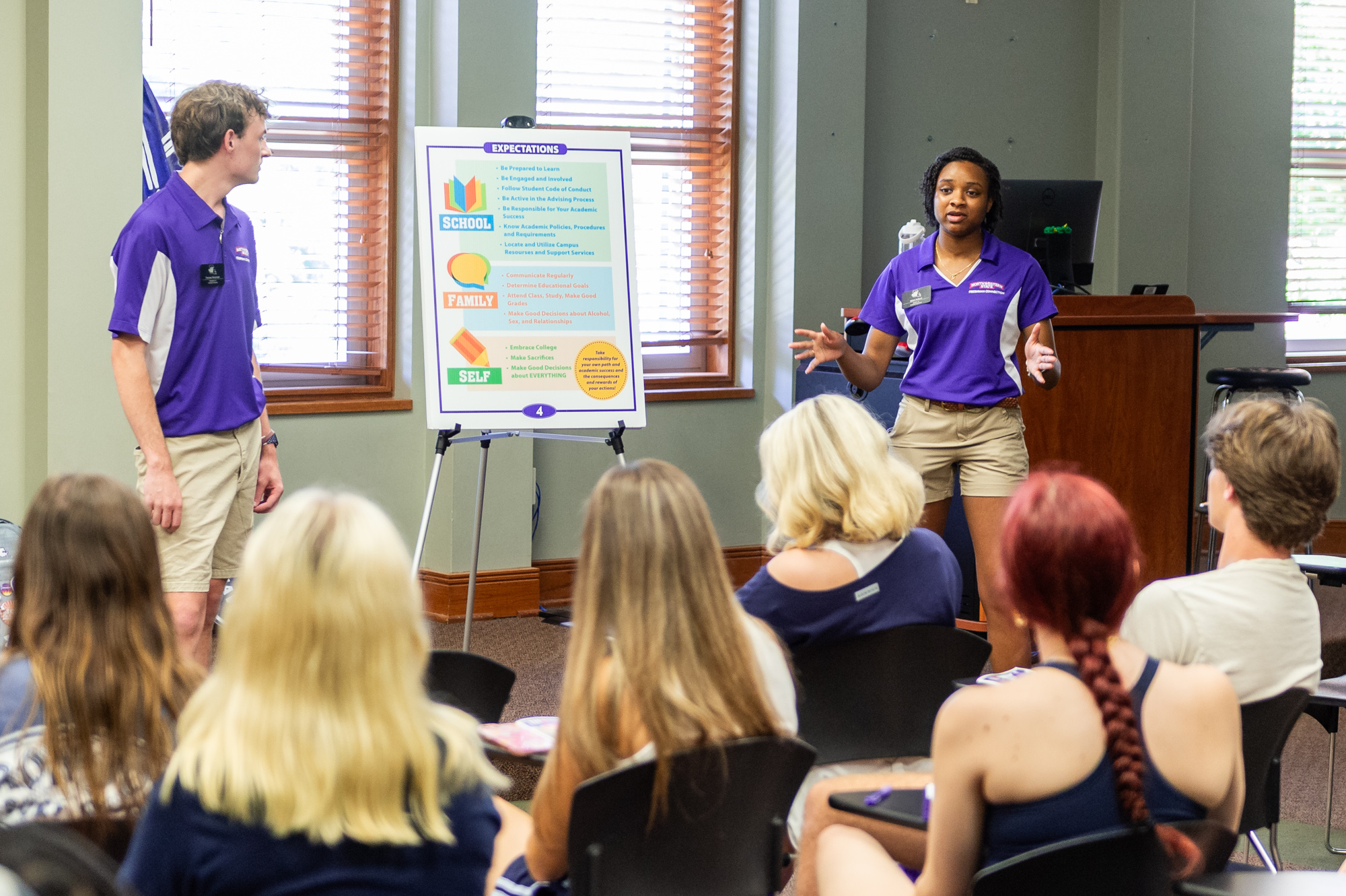 Freshman connector speaking to students