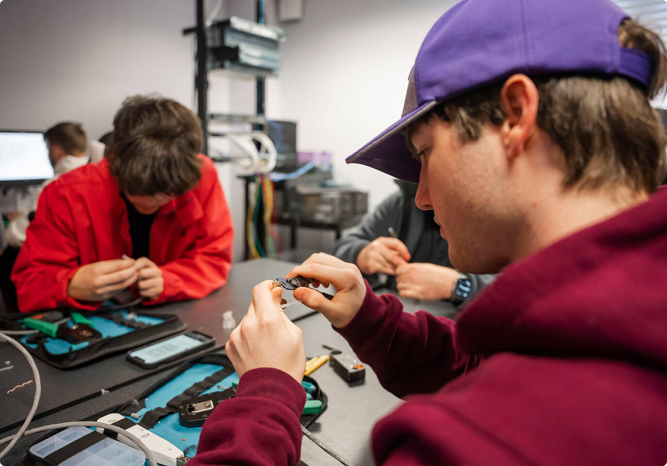 Students working on computer parts.