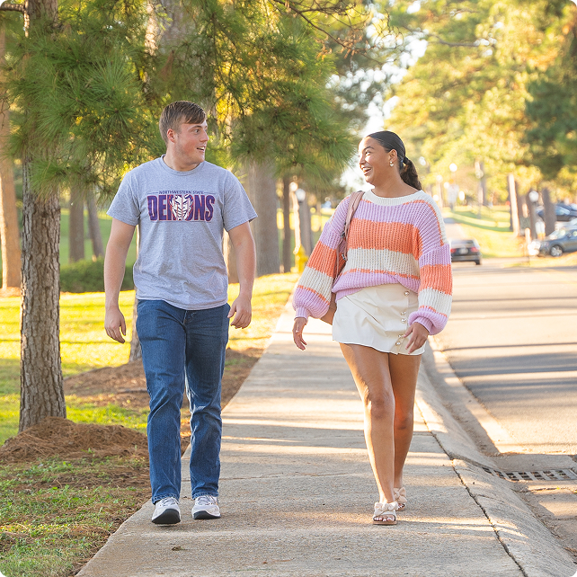 NSULA students walking together outside on campus