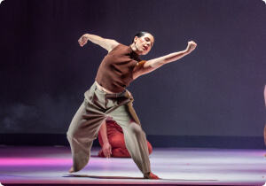 A student dancing on stage.