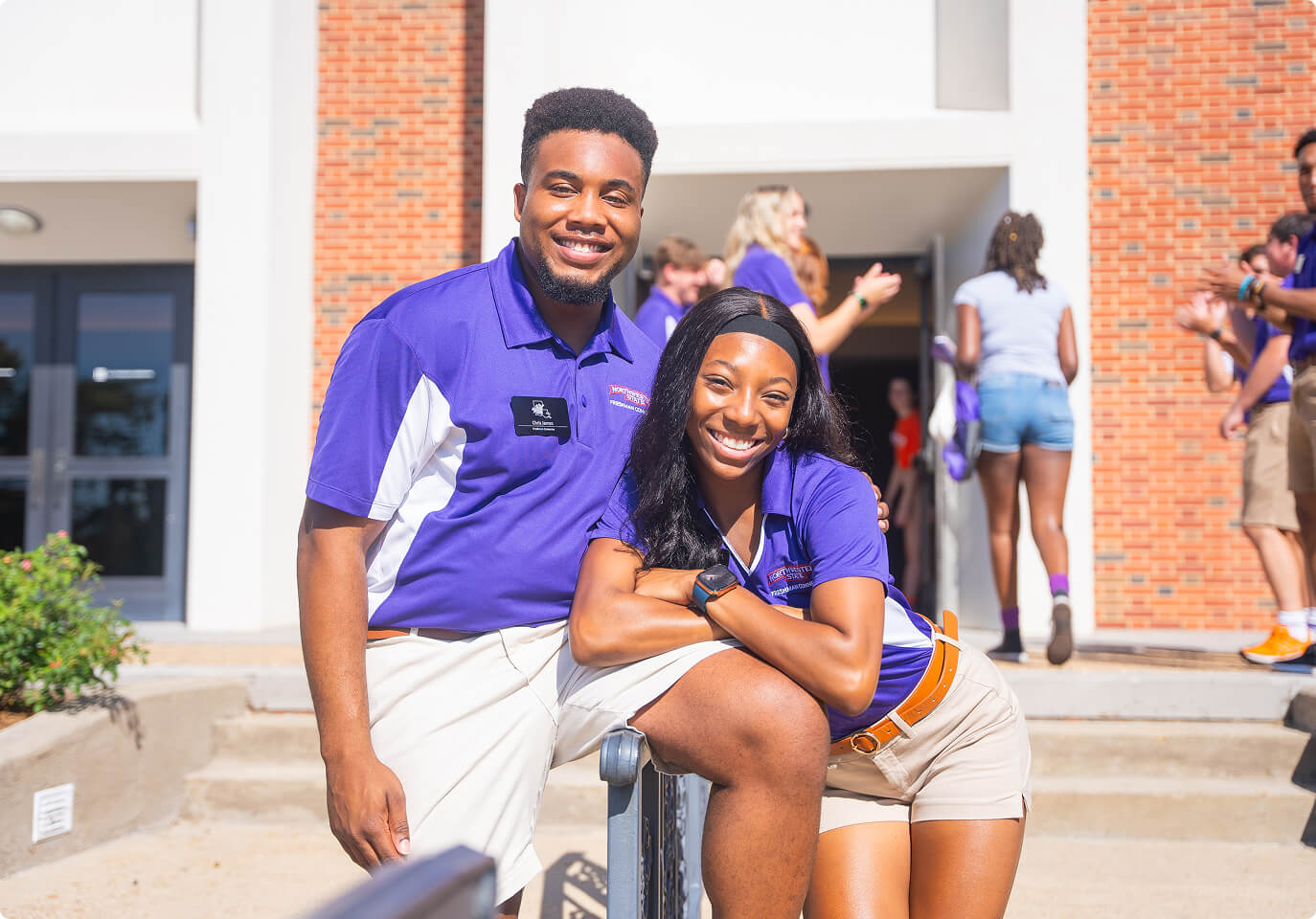 Two students outside a building on campus.