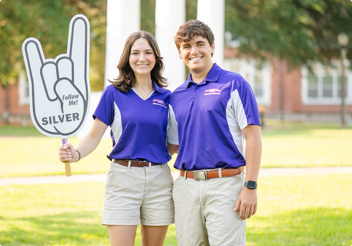 Two NSULA students wearing university shirts.