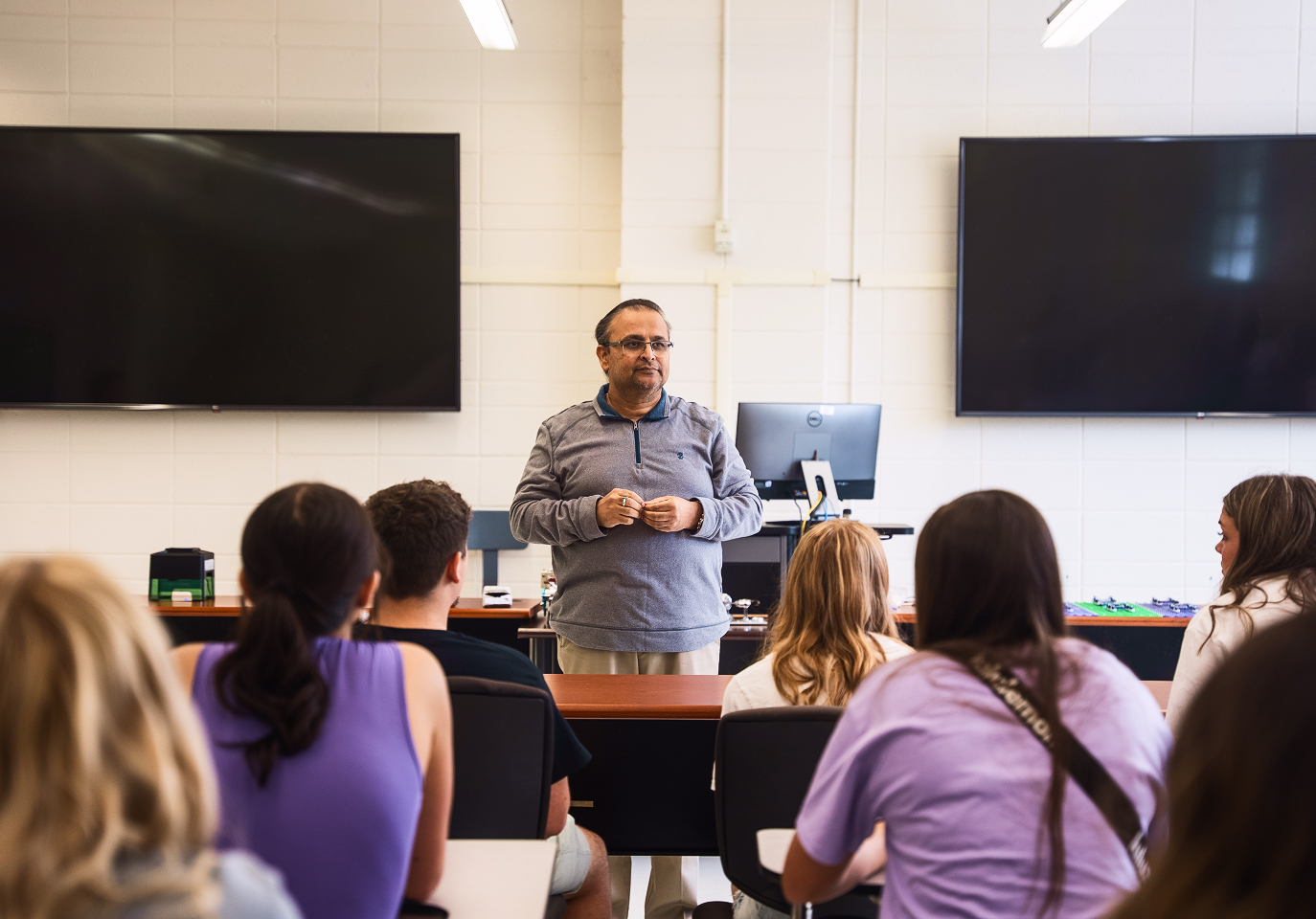 Teacher at NSULA giving instructions to class in classroom on NSULA campus