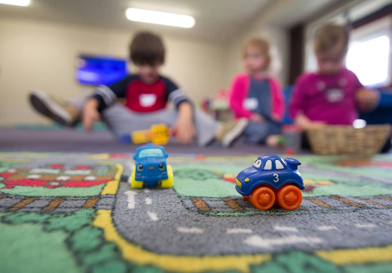 Kids playing with cars