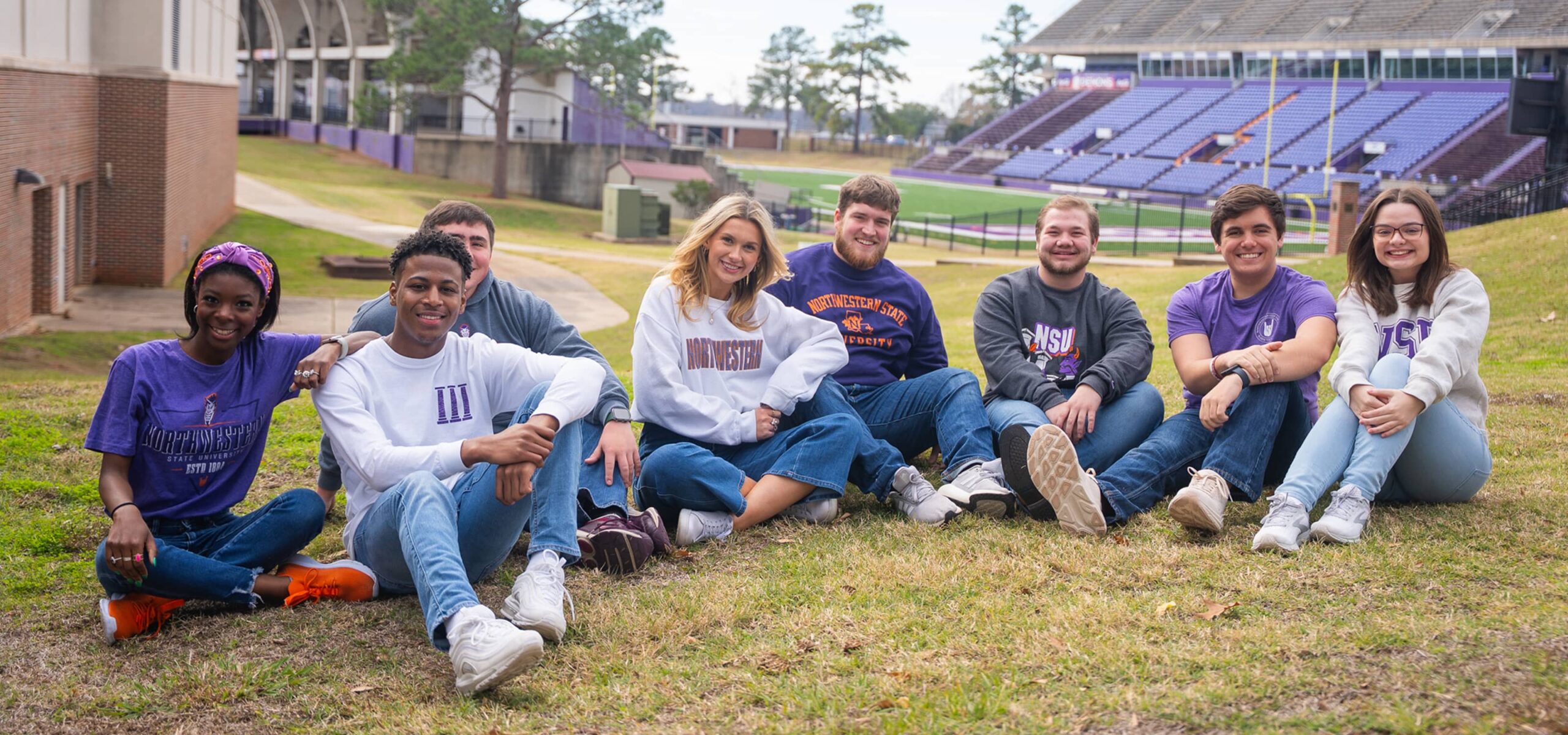 Students sitting outside on campus