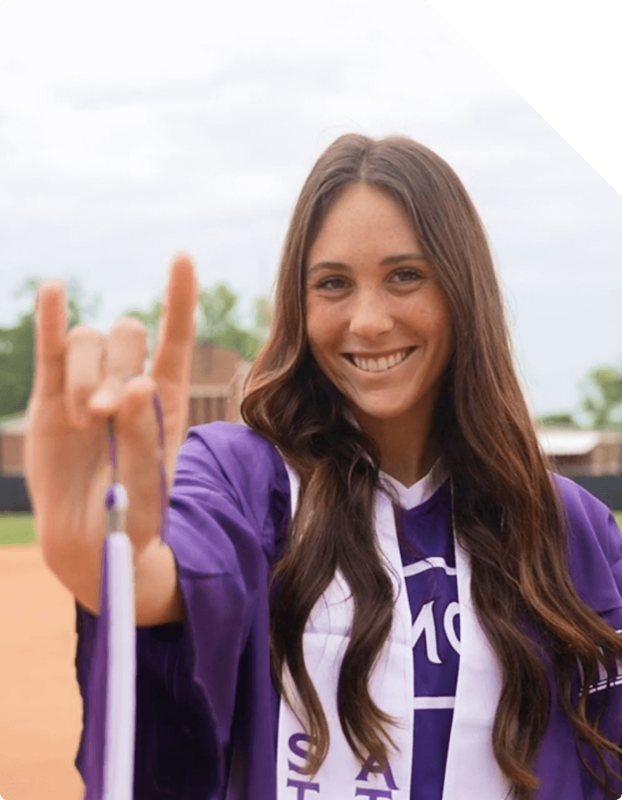 A student making the Fork Em hand symbol.