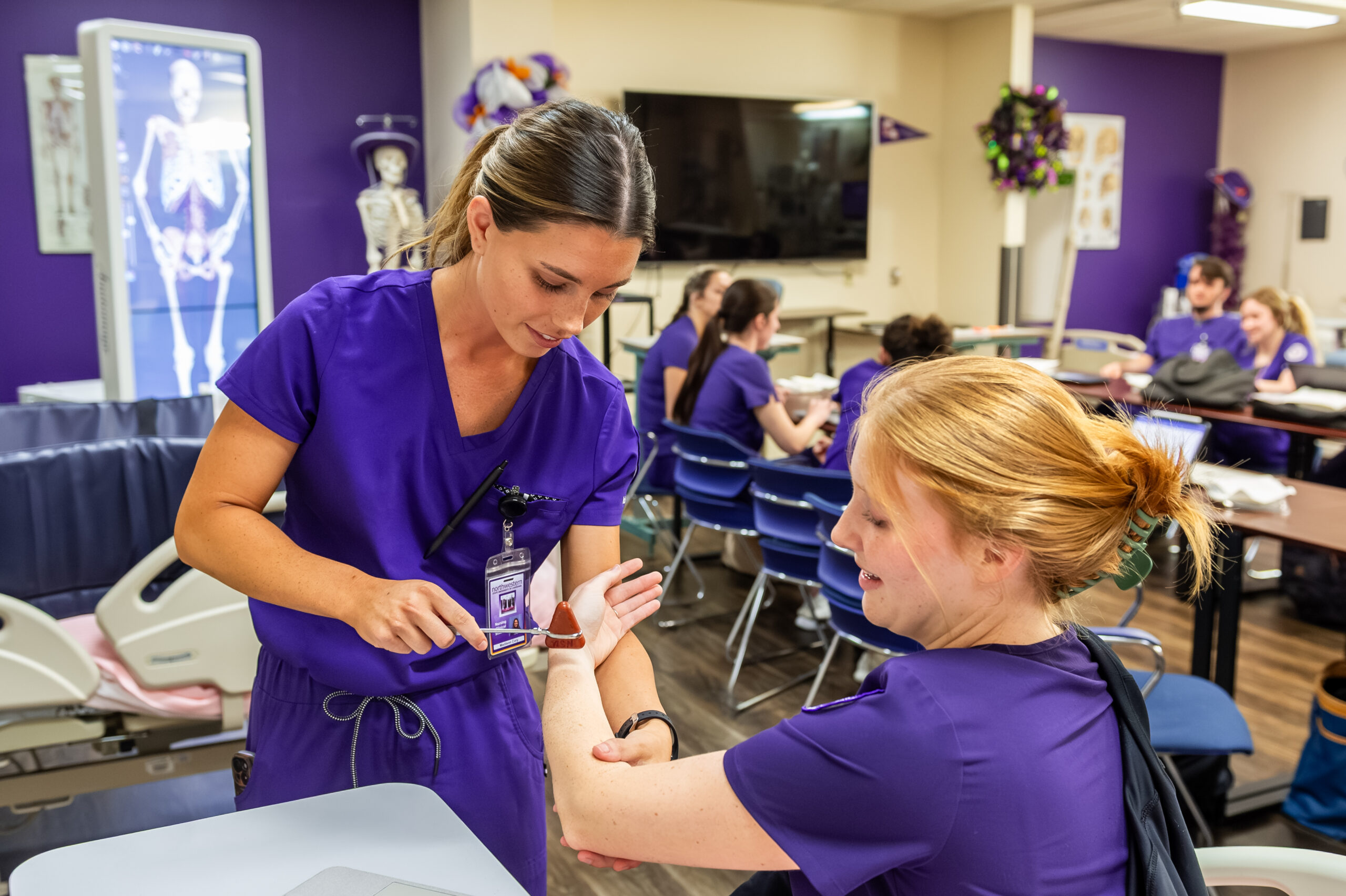 NSU Nursing students practice performing skills on classmates