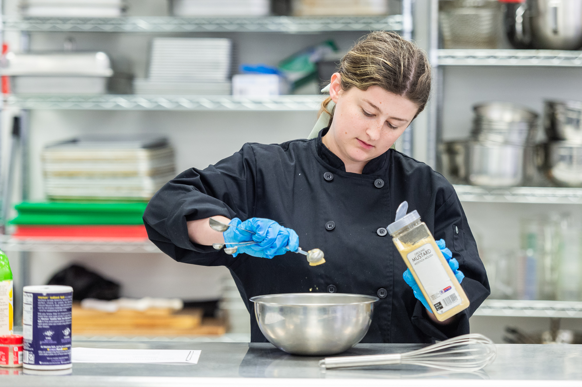NSU Culinary arts student works in the kitchen