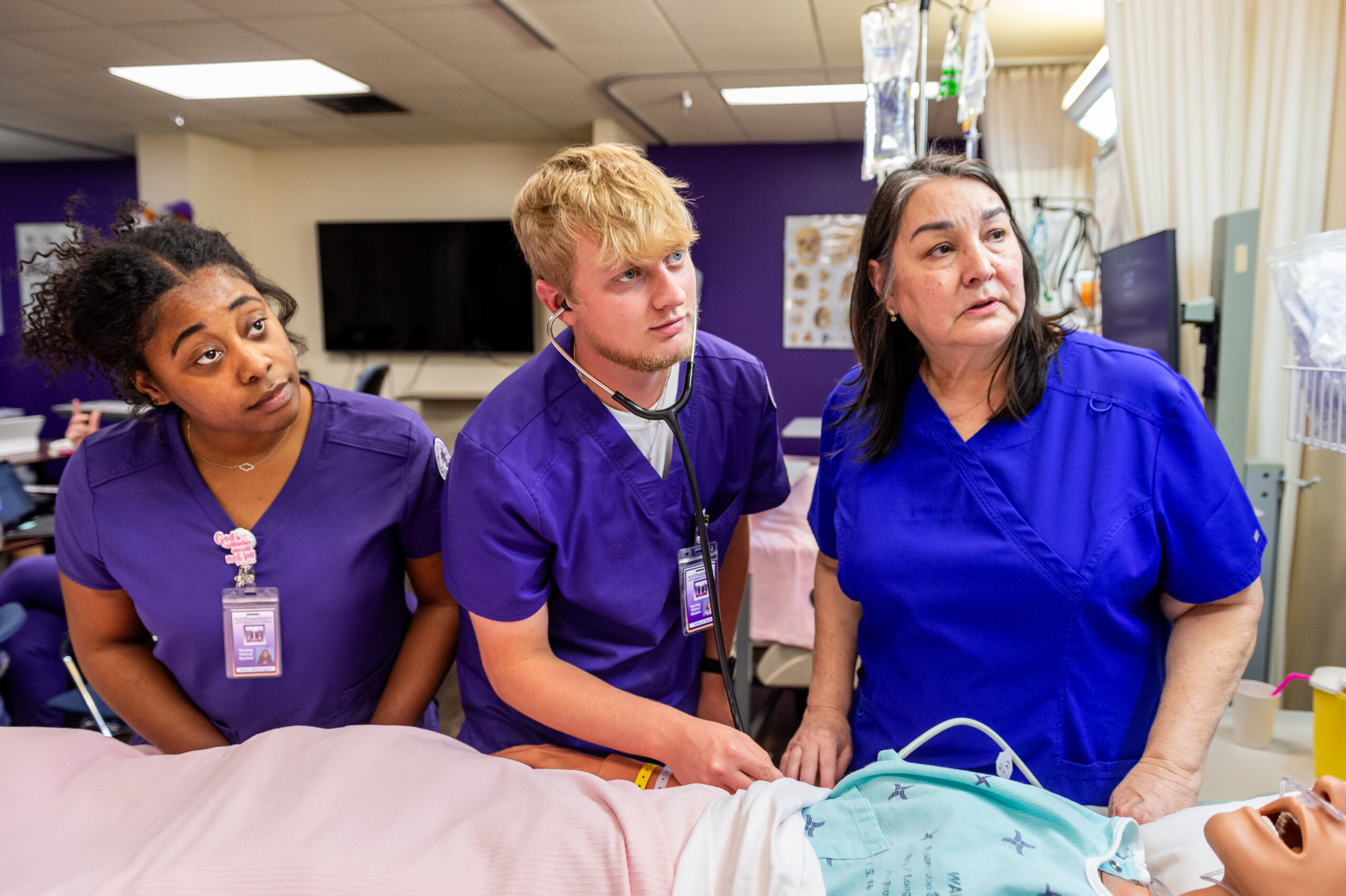 NSU Nursing students learn from instructor in lab
