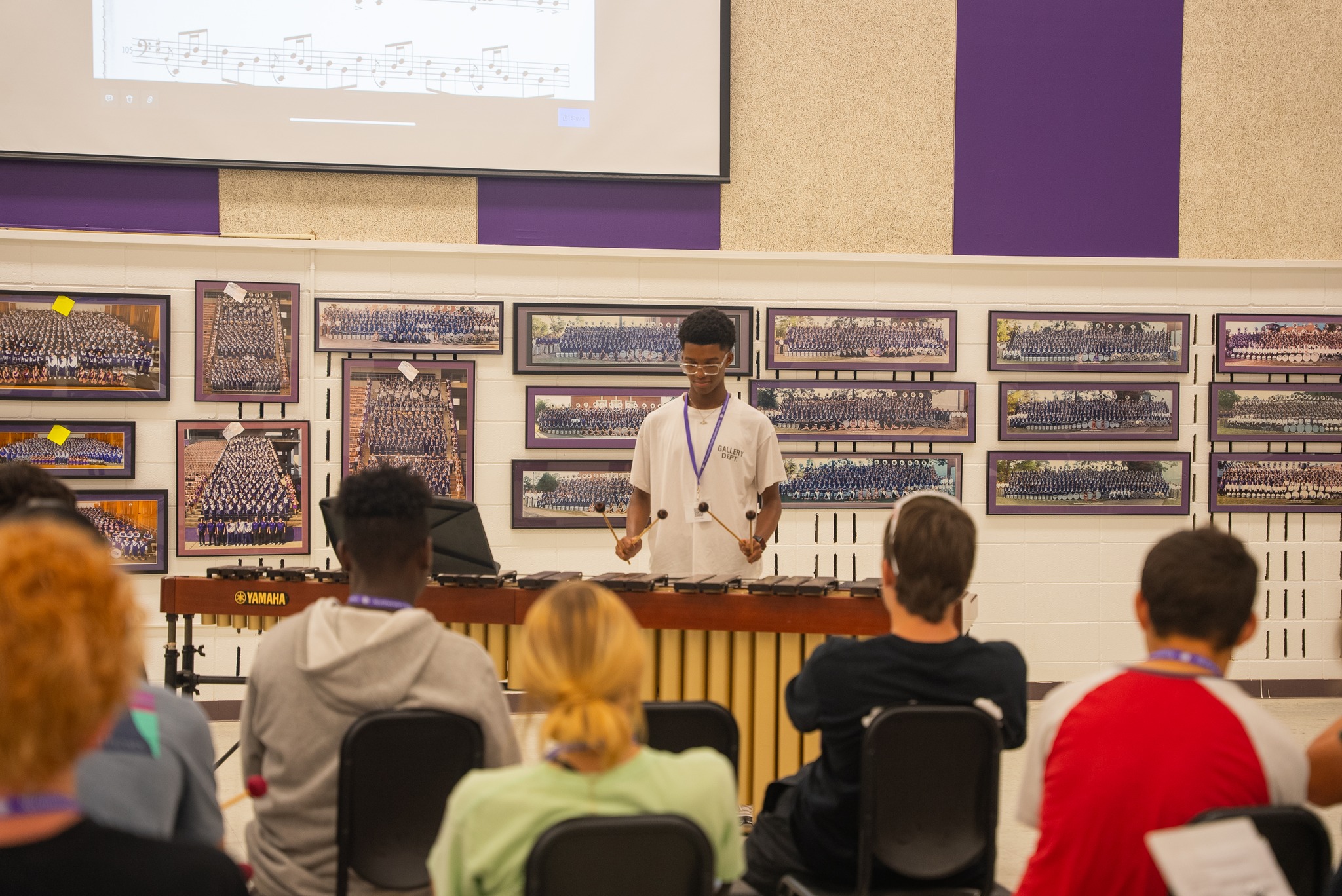 NSU Music student plays instrument in front of class