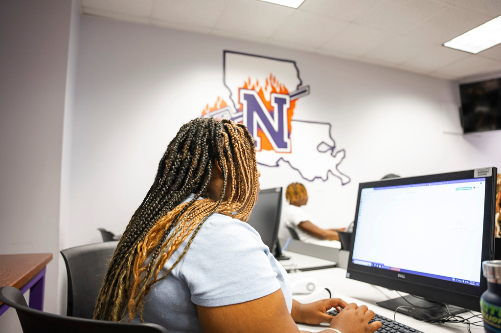 Student working on computer in Russell Hall computer lab