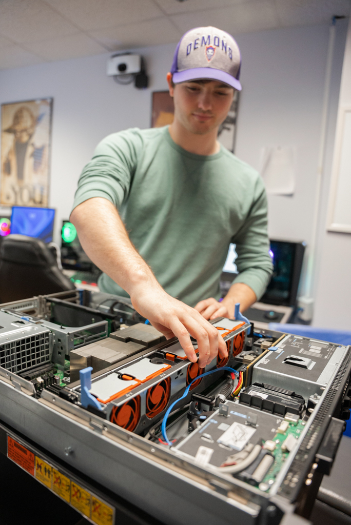 NSU student does maintenance on computer hardware