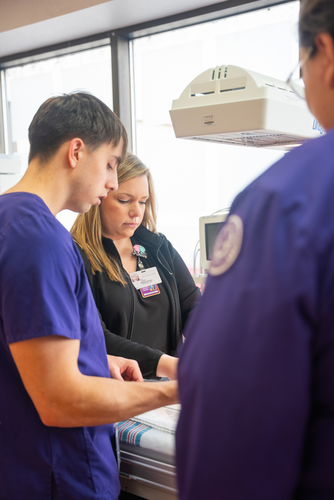 NSU instructors assist students with hands-on learning