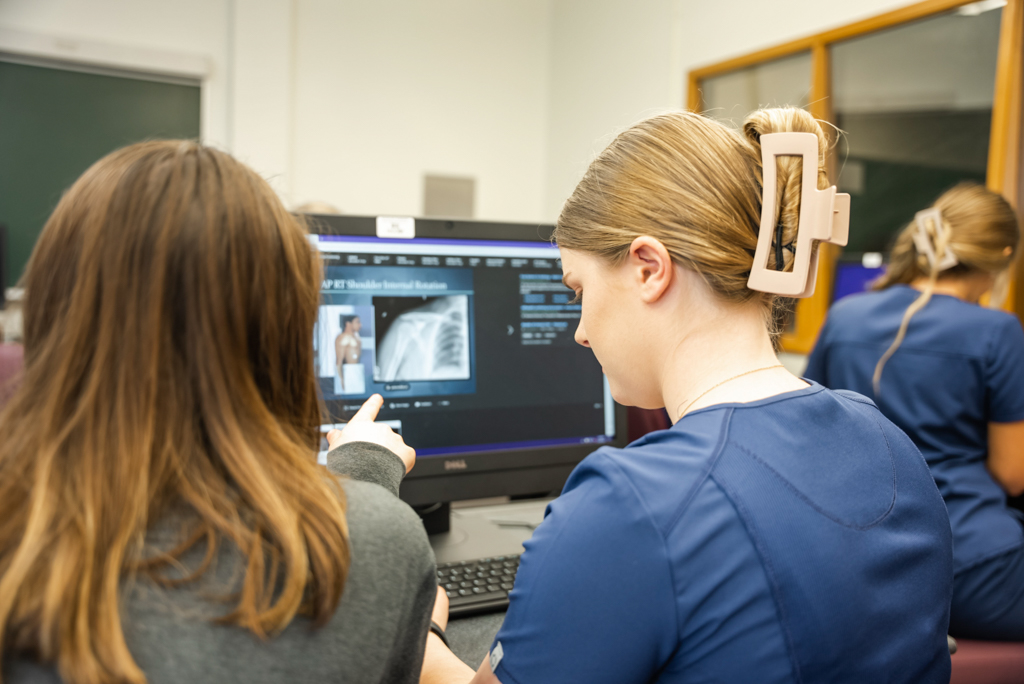 NSU Nursing instructor assists student
