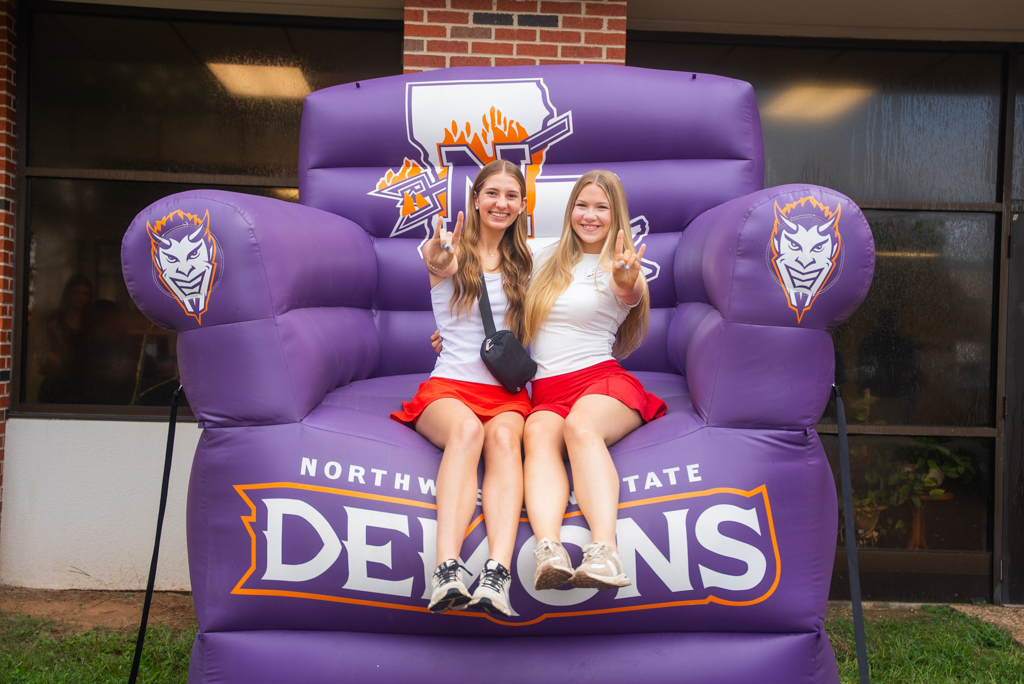 NSU students pose for a photo on the inflatable chair