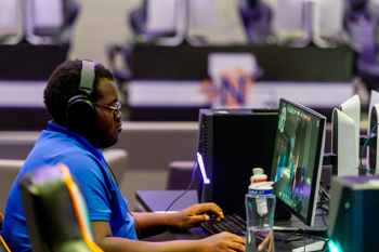 NSU student utilizing the E-Sports lounge on campus
