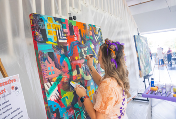 NSU student painting a mural