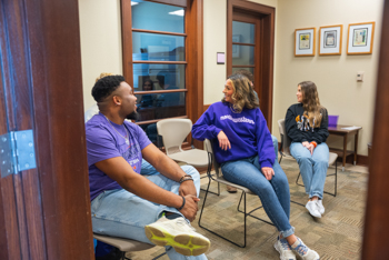NSU student talking to each other in study lounge.