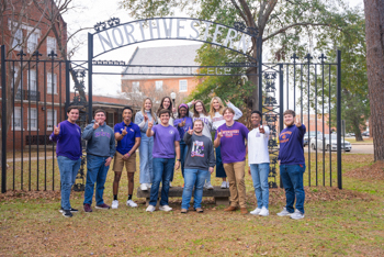 Students at old gates of Northwestern.