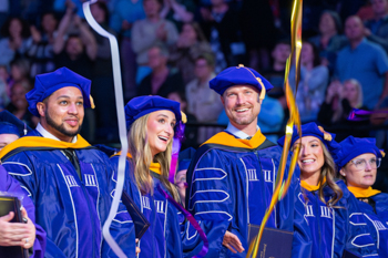 Graduate students at commencement ceremony.