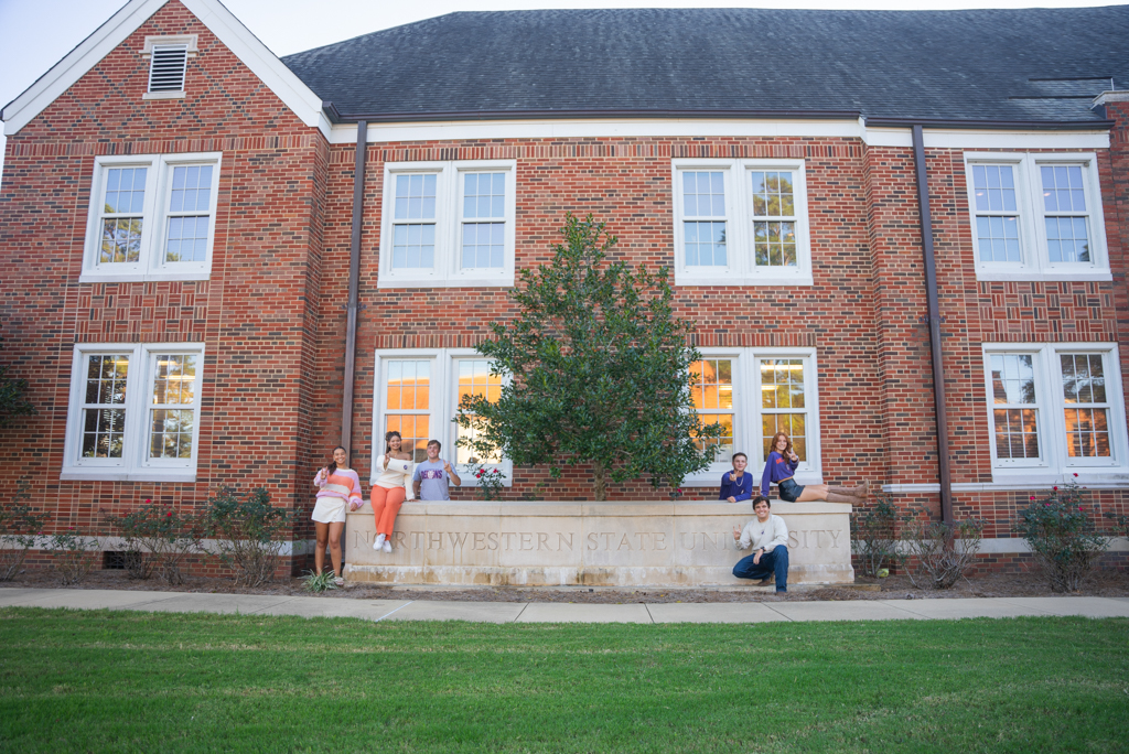 NSU students pose in front of Caspari Hall