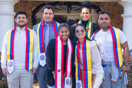 International Students in front of President's Residence on campus at NSU.