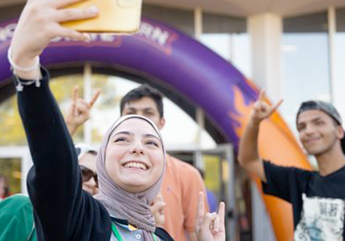 Group of NSU students gather for a selfie.