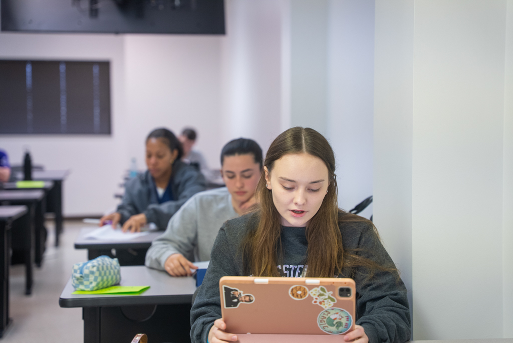 NSU students taking notes in class
