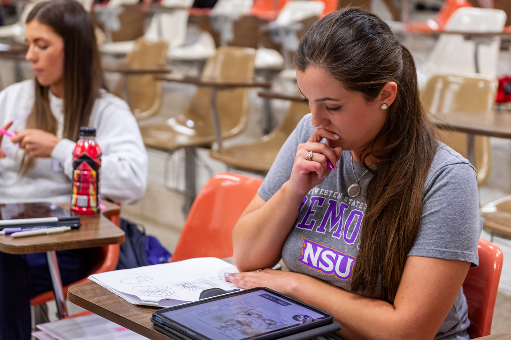 NSU student studies her notes