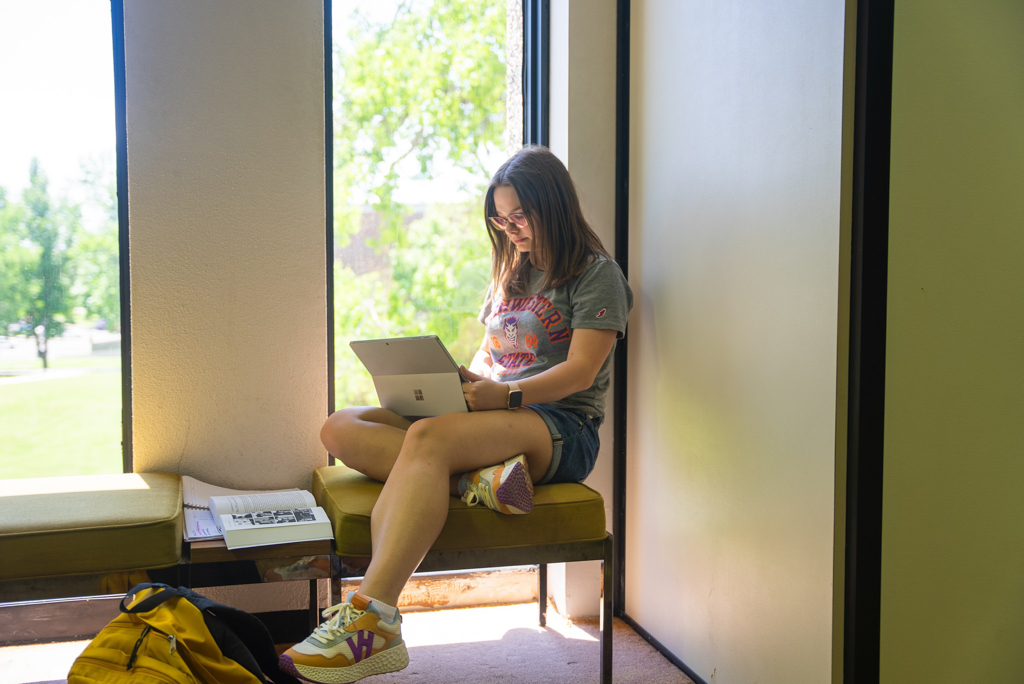NSU student studying in the library