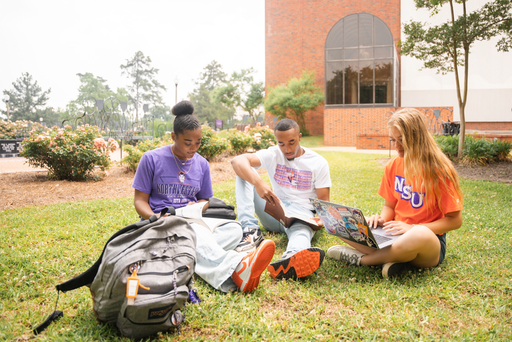 A group of NSU students studying in the plaza on campus