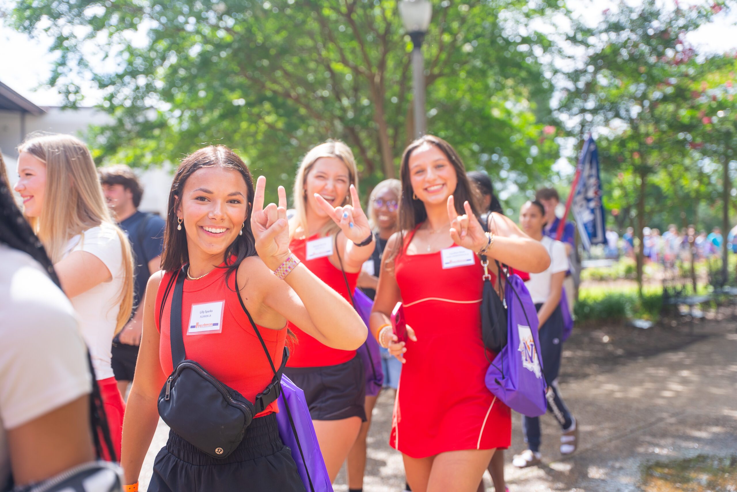 NSU students smile as they walk with their orientation group