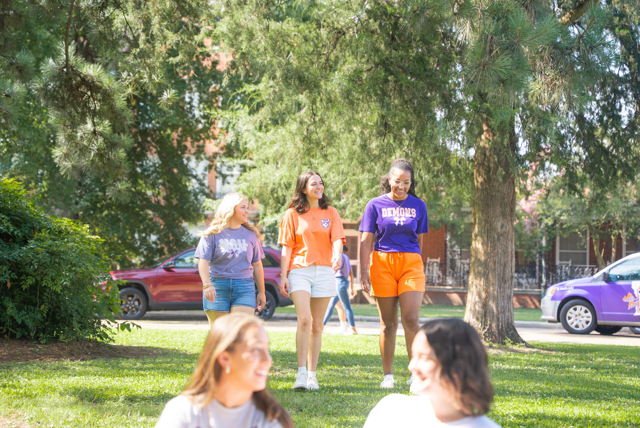 Students gather on the front lawn of Varnado Hall
