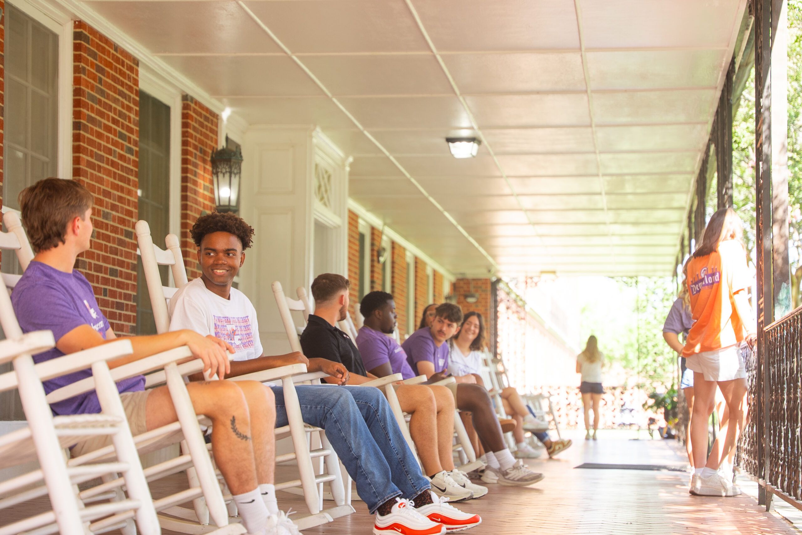 NSU students sit on the front porch of Varnado Hall