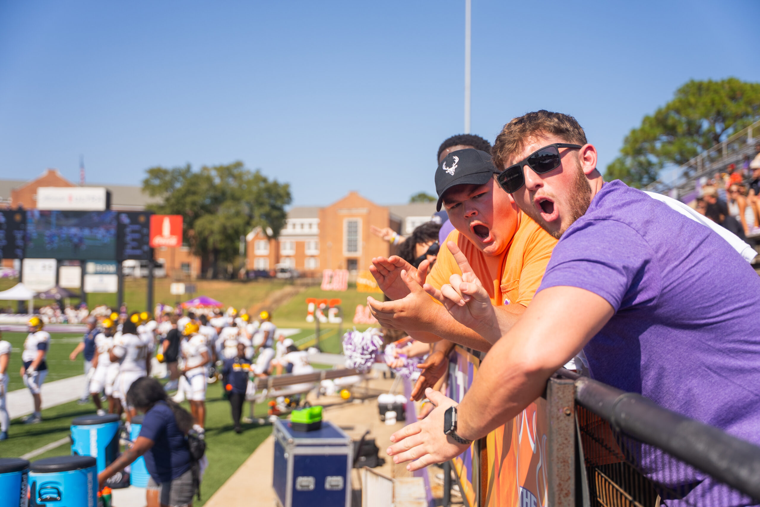 NSU students cheering on the Demon football team during a game