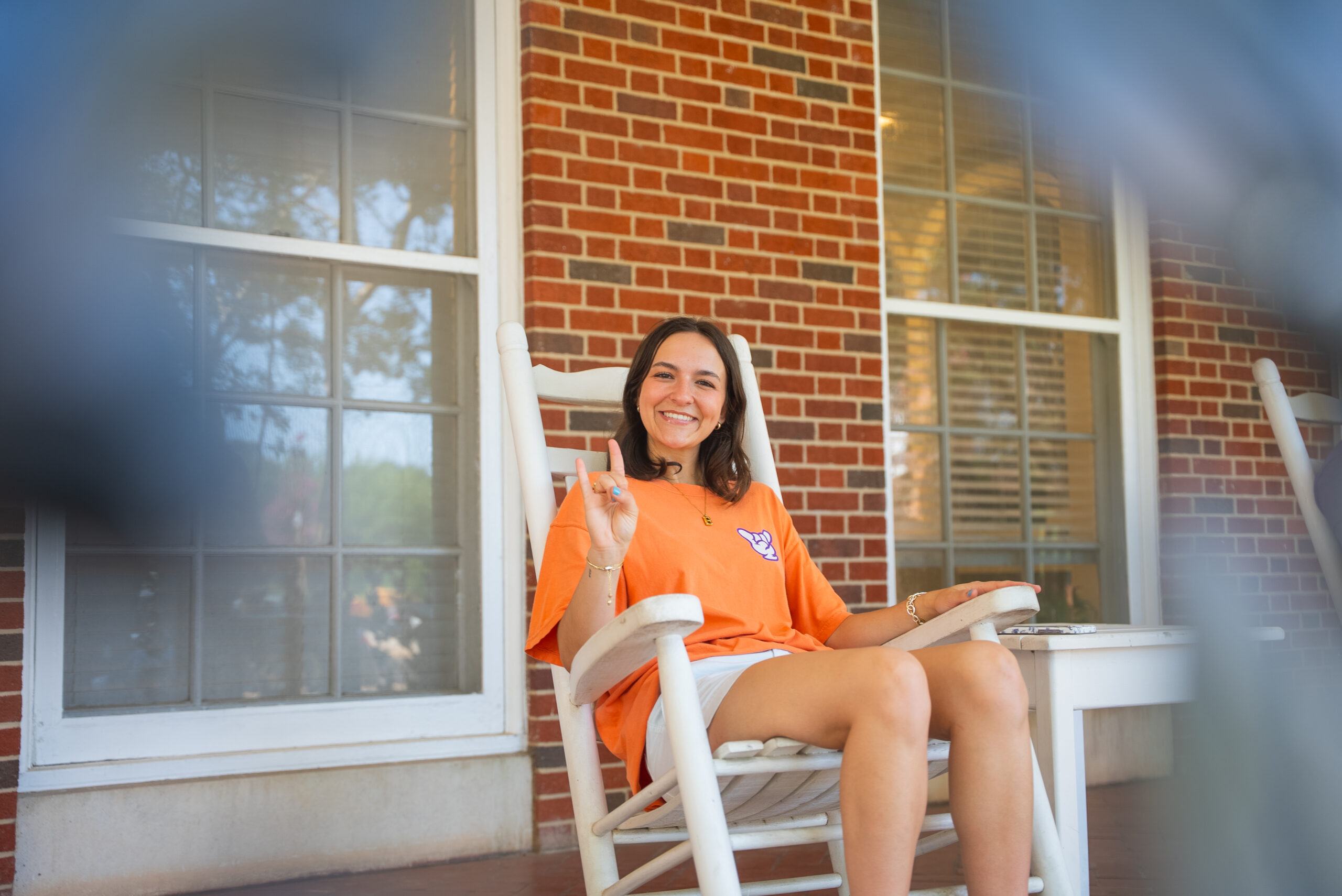 NSU student sits outside residence hall
