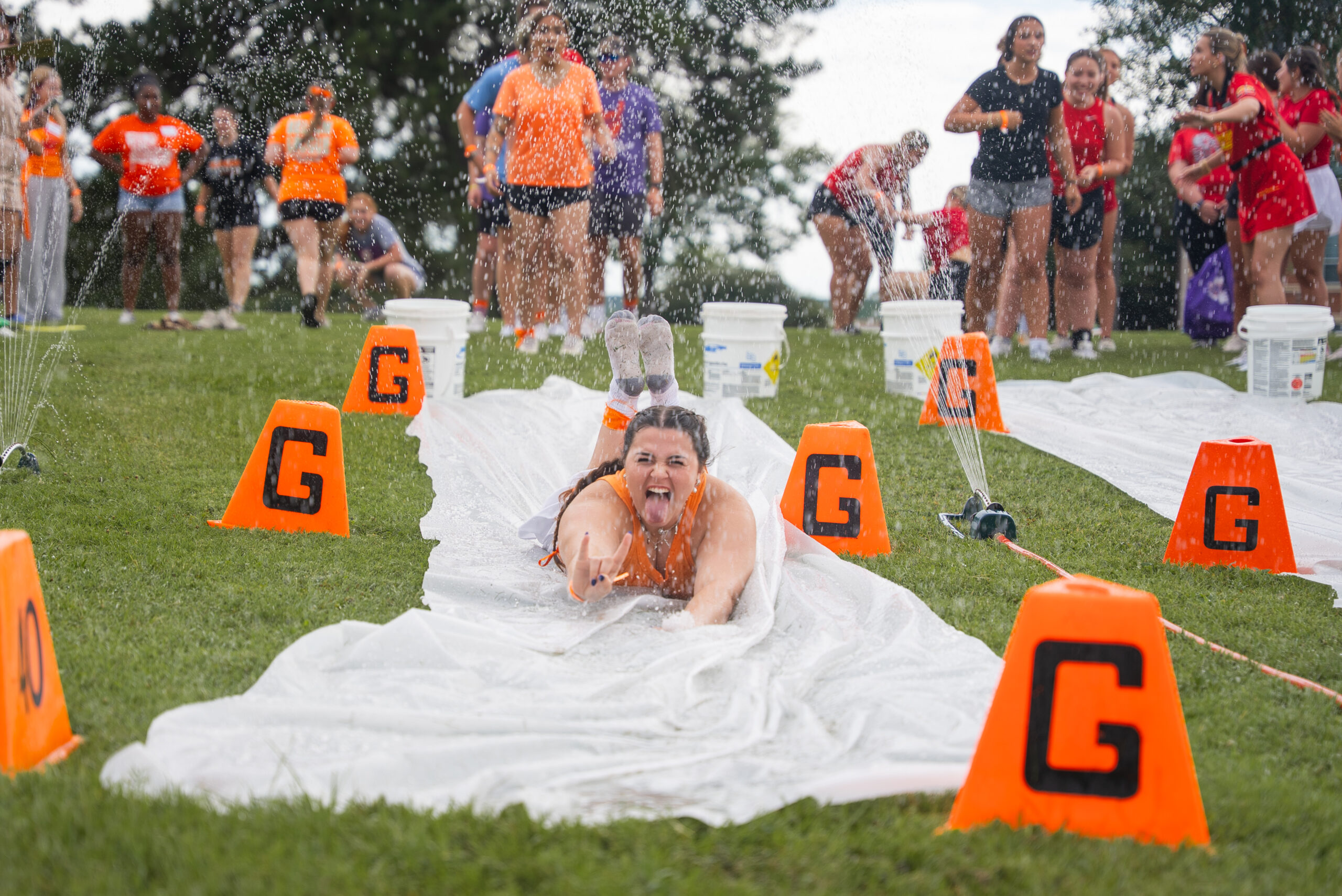 NSU student slides down waterslide at Freshman Connection