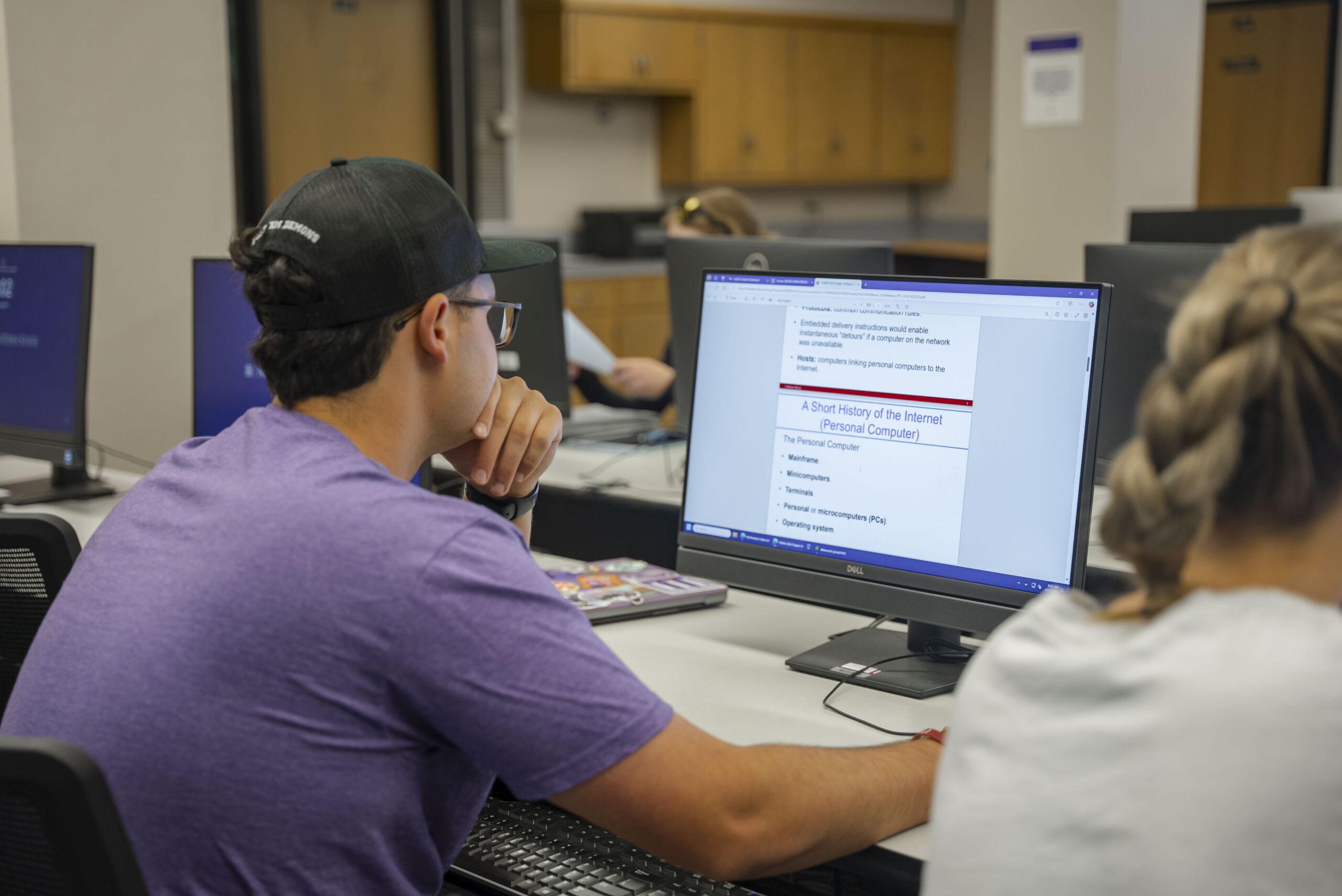 Students complete homework in the computer lab