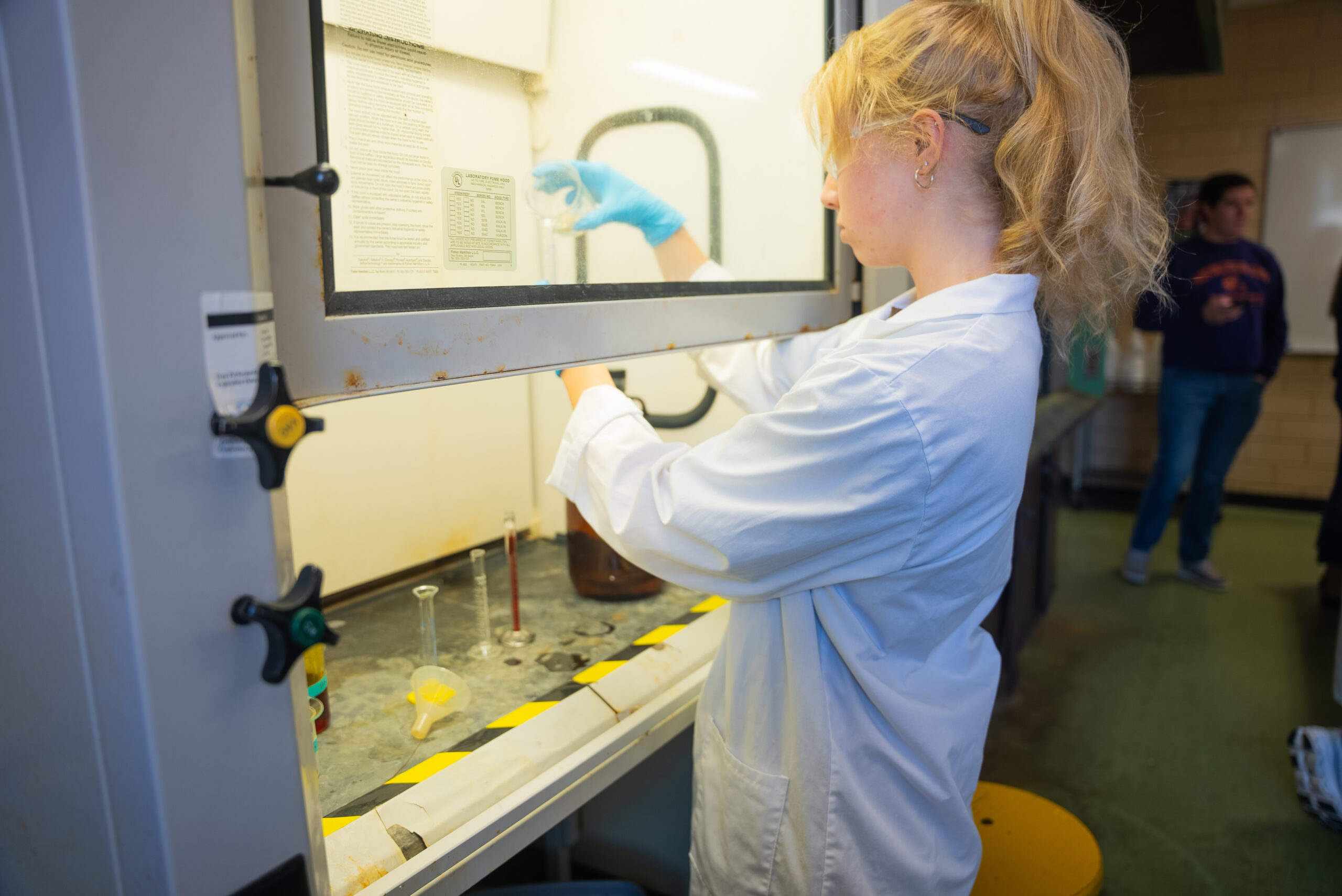 NSU Biology student in lab.
