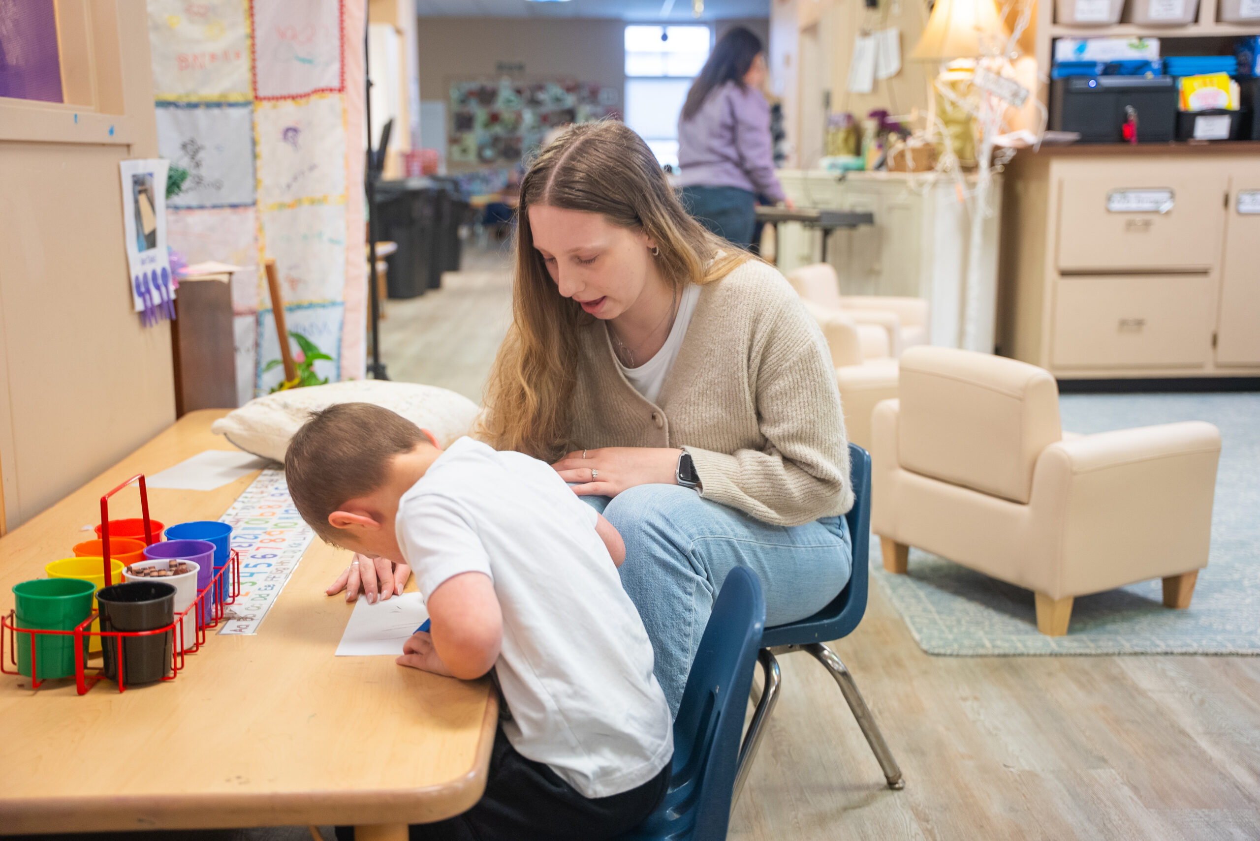 NSU E-Lab teacher works with young student