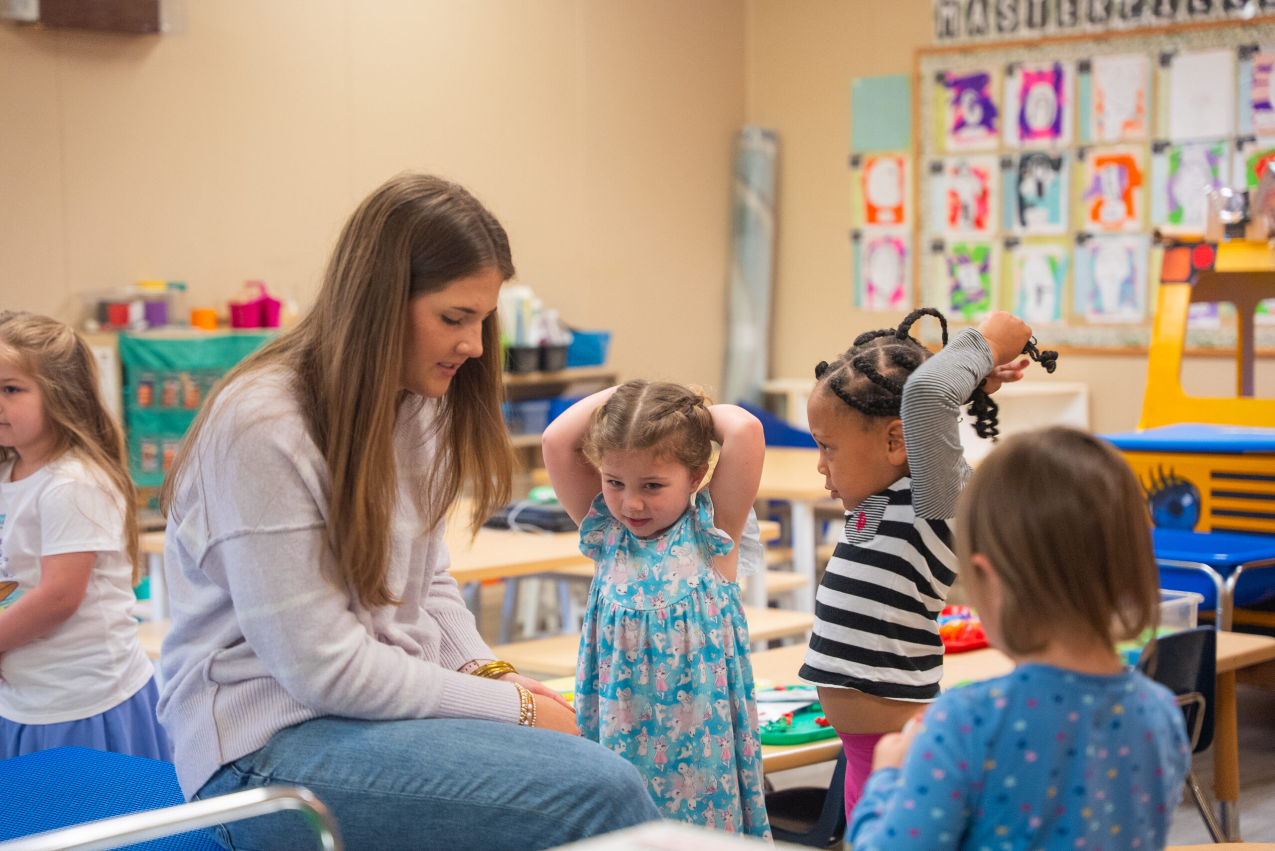 NSU E-Lab teacher speaks with young students