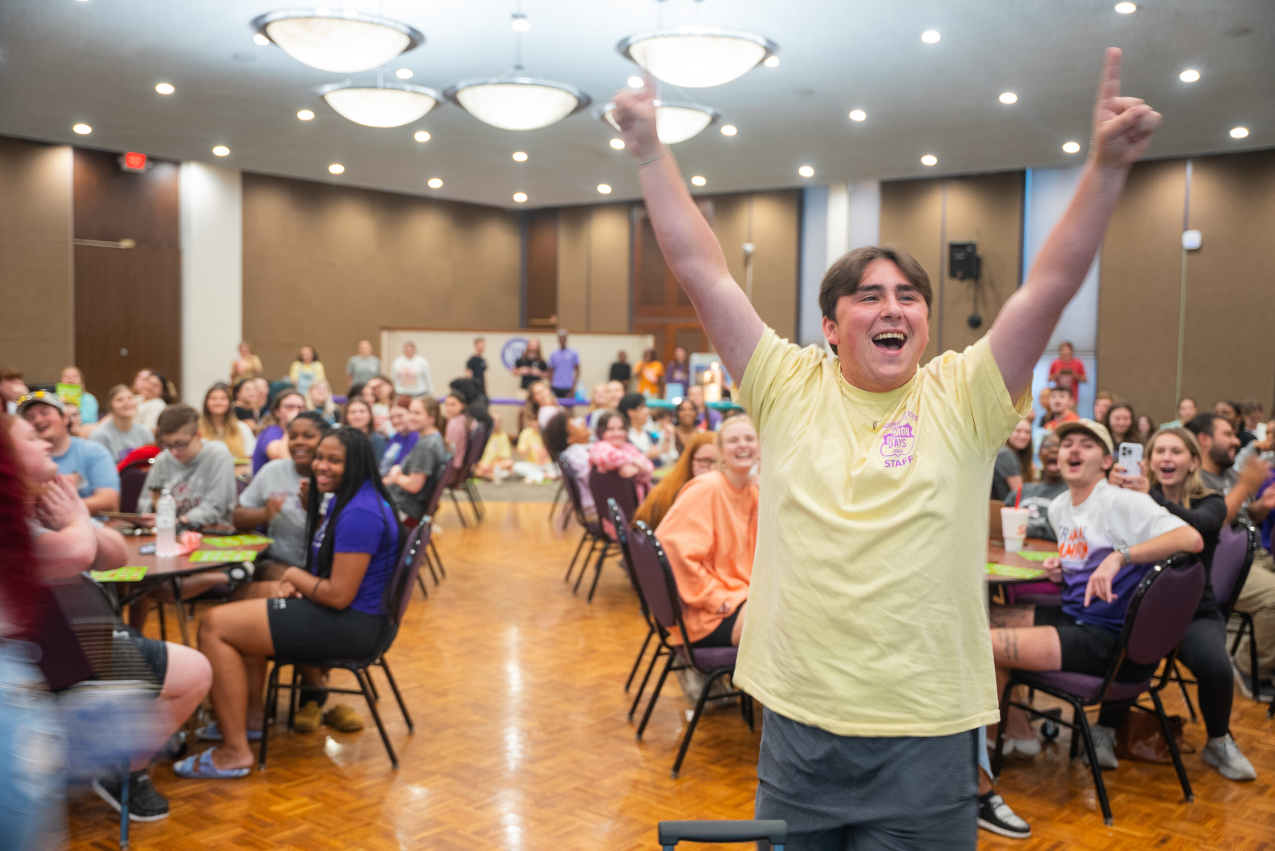 NSU student stands and shouts as he wins BINGO during a Welcome Week activity