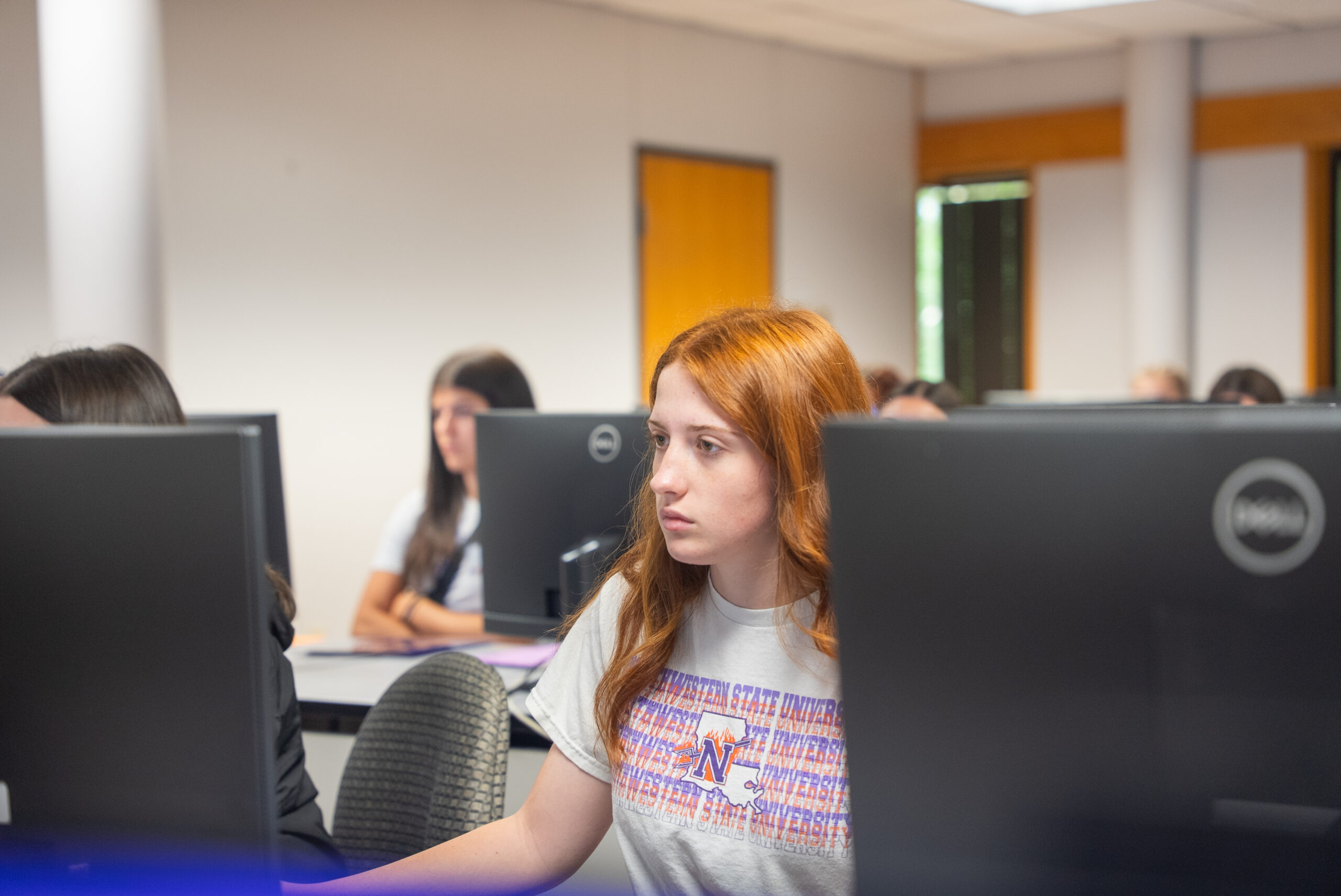 NSU student works on computer in computer lab