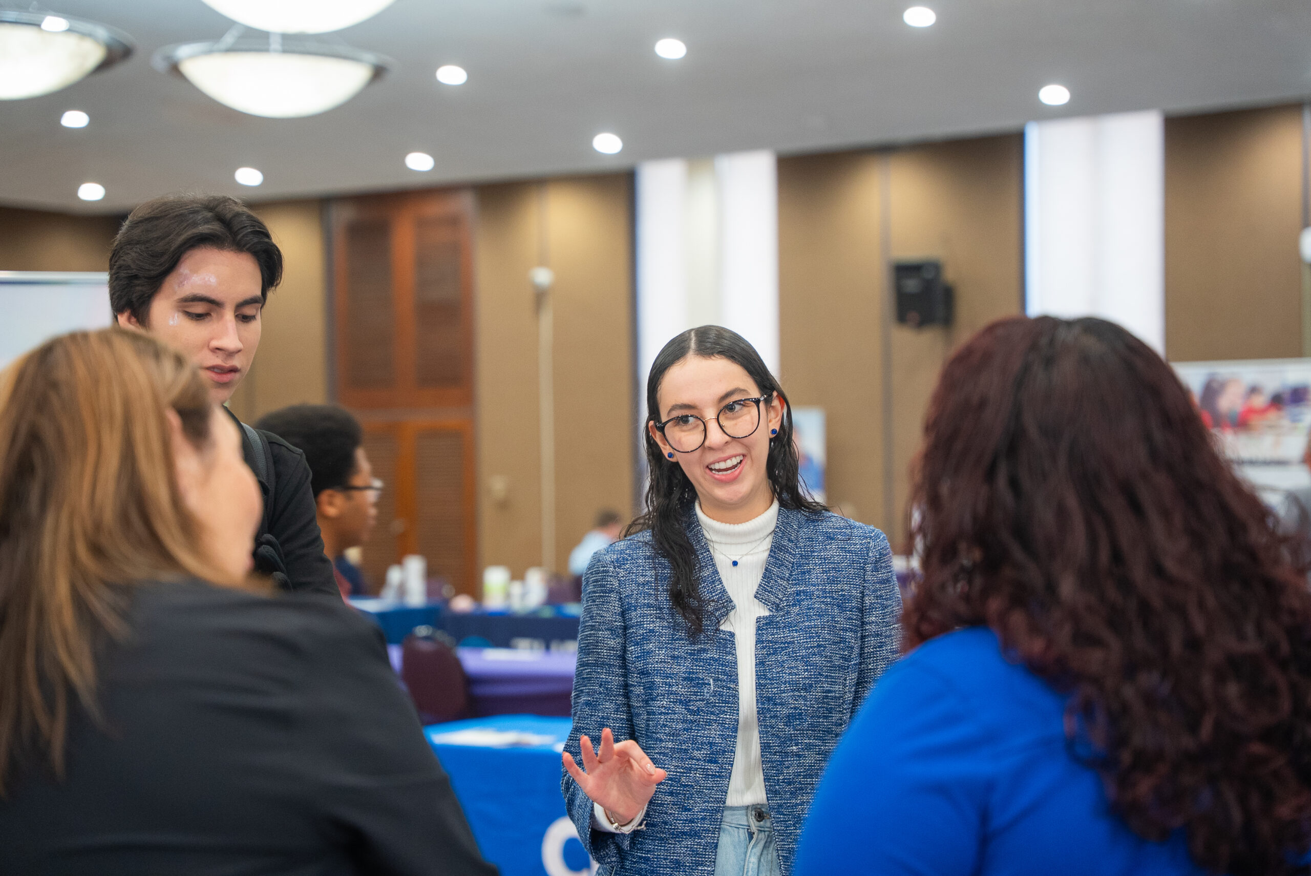 Students speaks to employer at Career Fair