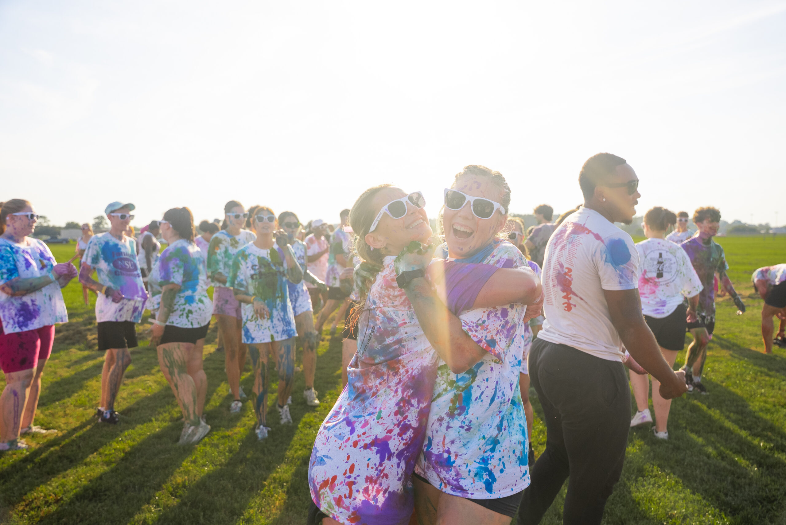 2 NSU students hug after participating in the annual Color Chaos event