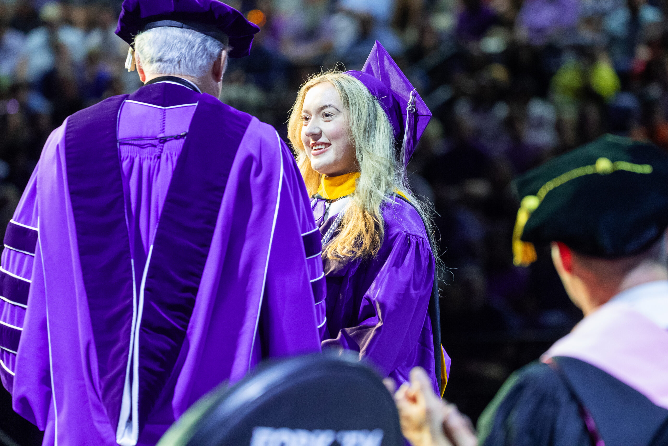 NSU Graduate receives diploma from President Genovese