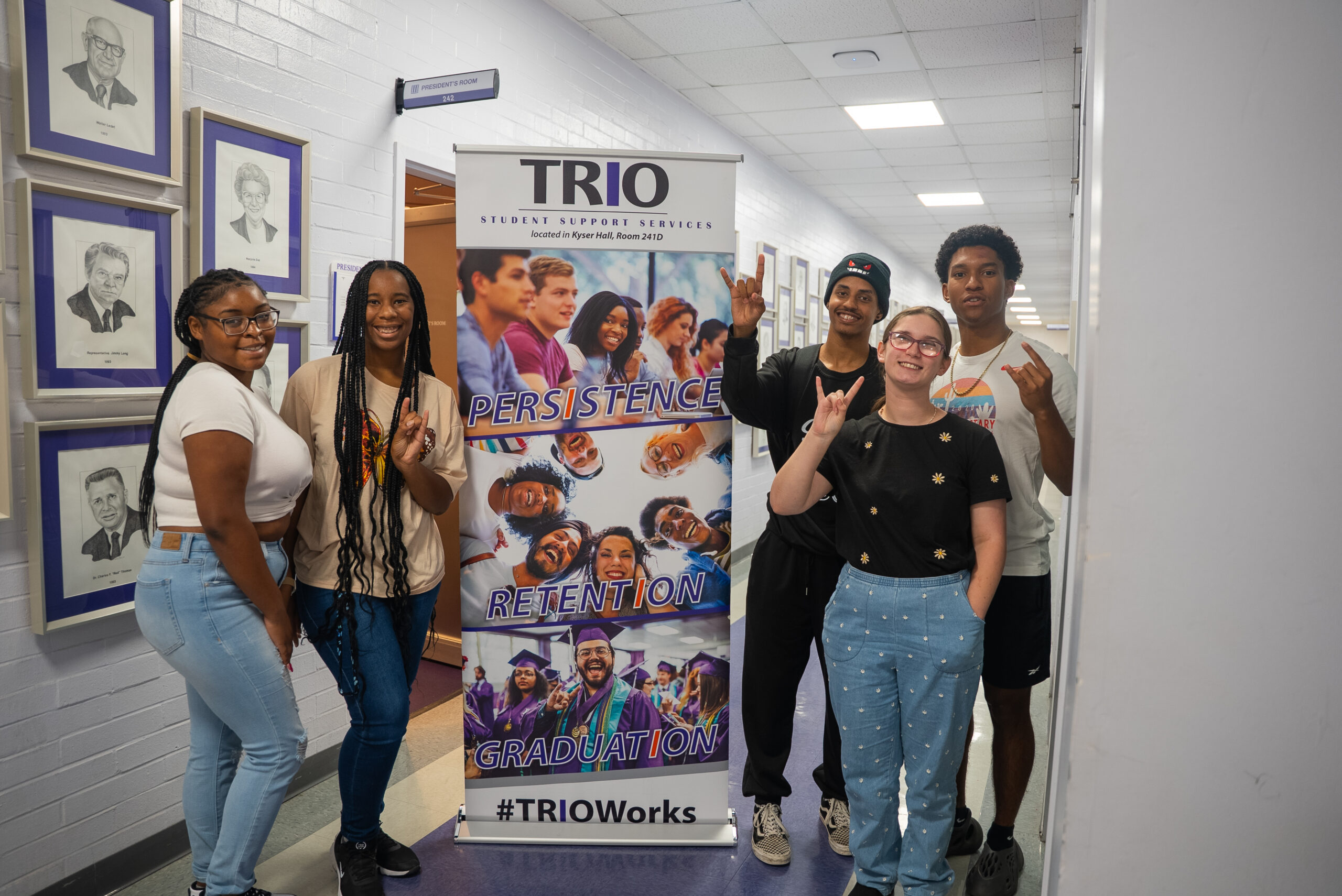 NSU students pose for a photo with Student Support Services banner