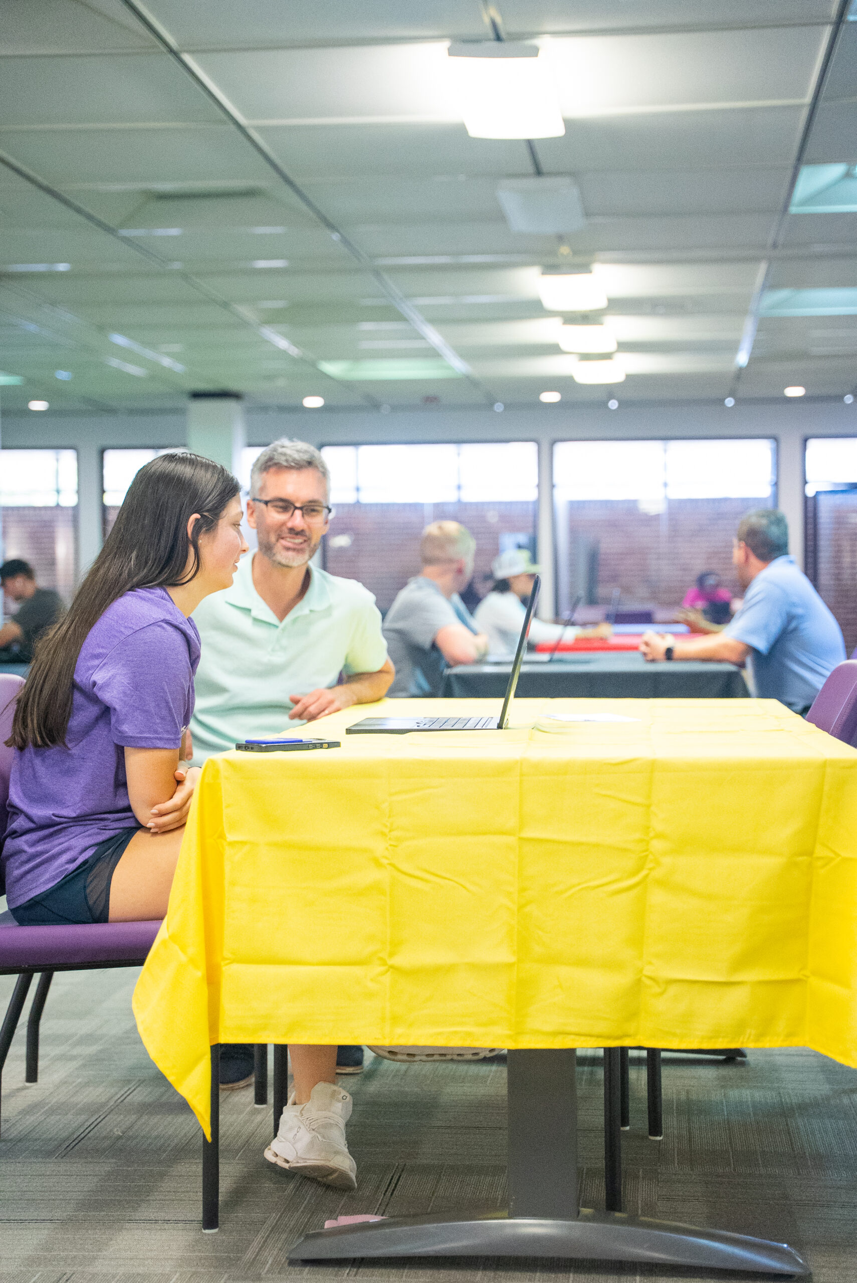 NSU student receives assistance from her instructor at the library