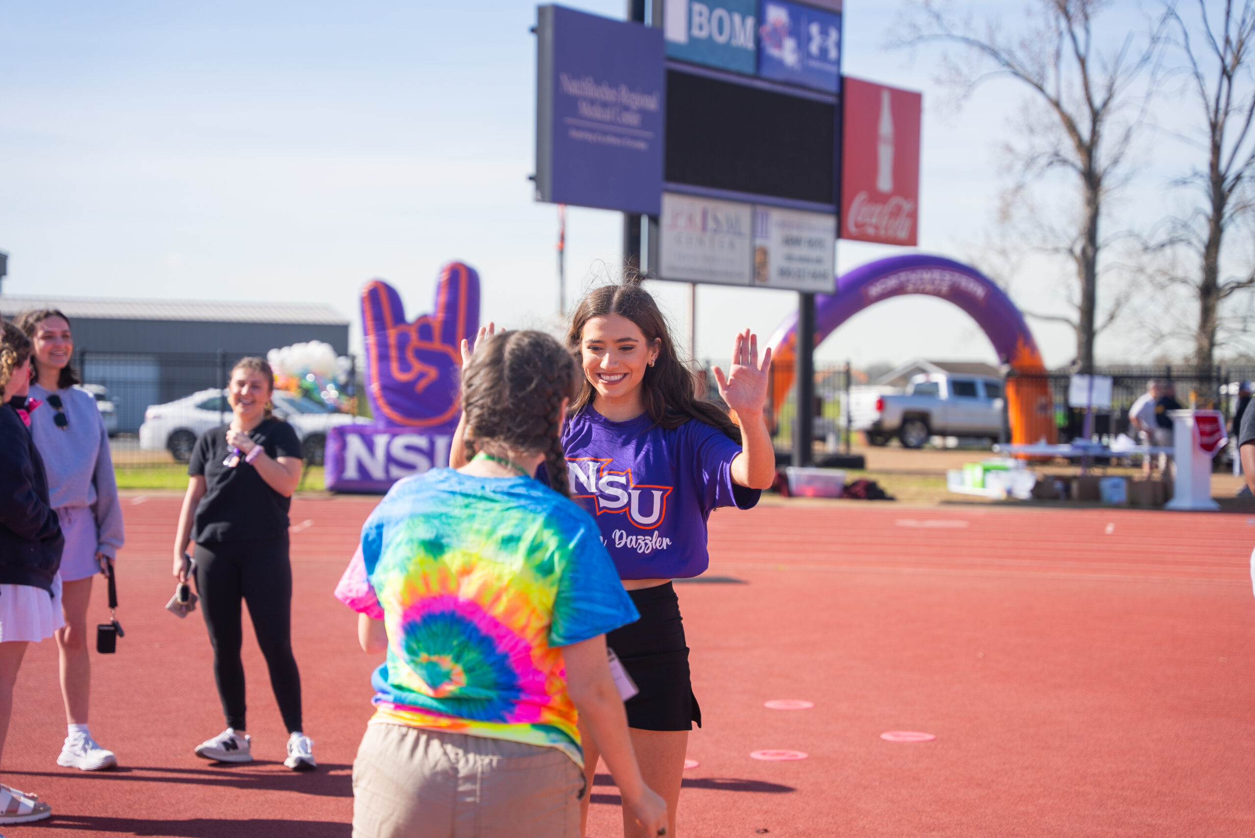NSU student participates in Special Olympics Games with young student